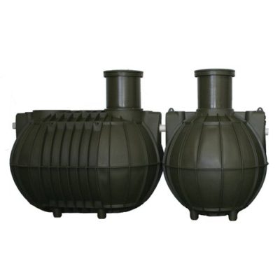 A pair of green 5,700 Ltr septic tanks on a white background, one of them equipped with an outlet filter.